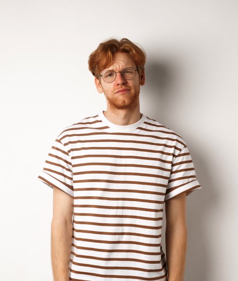 reluctant-and-unamused-redhead-young-man-staring-a-2ZK43U3.jpg